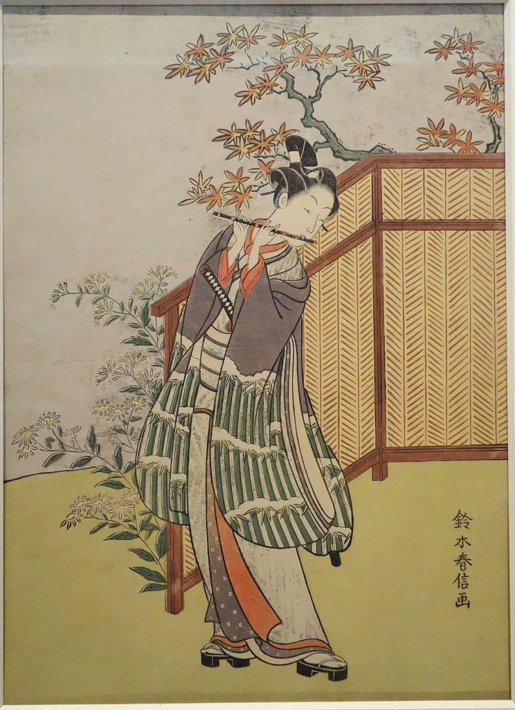 Young Man Playing Flute by Suzuki Harunobu