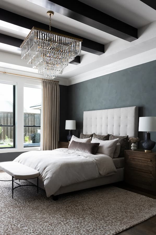 Contemporary bedroom with Arhaus chandelier